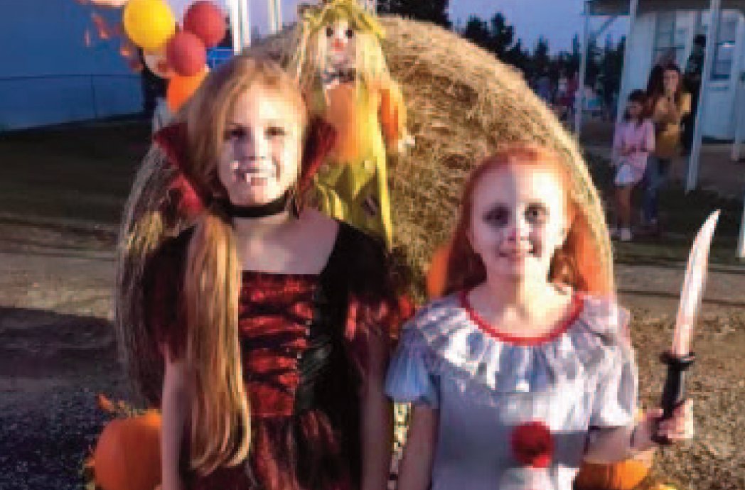 Cheyenne and Savannah Allen are dressed up in their Halloween best playing games and taking part in the festival.